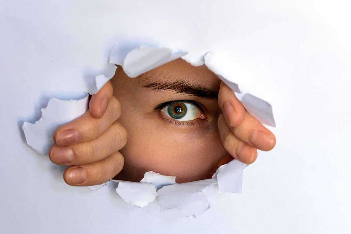 The,green Eyed,girl,looking,through,torn,paper.,spying,,glancing